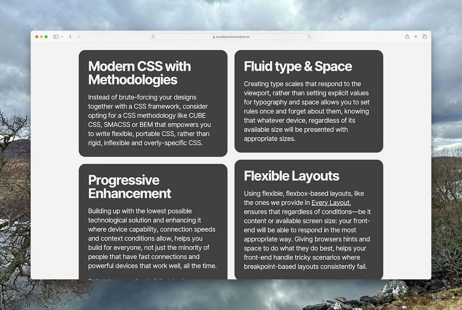 Dark grey tiles with white text arranged in a masonry grid in Safari, with a slightly modified source order